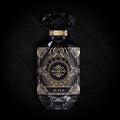 Al Ula Eau de Parfum by Essenzia, faceted black bottle with gold label and smoked crystal base