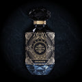 Shimmer Eau de Parfum by Essenzia, faceted black bottle with gold label and blue crystal base
