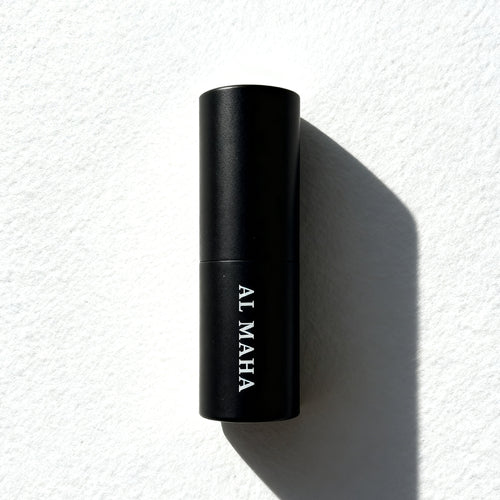 Al Maha Eau de Parfum by Essenzia, faceted black bottle with gold label and smoked crystal base