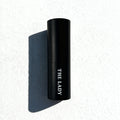 The Lady Eau de Parfum by Essenzia, faceted black bottle with gold label and red crystal base